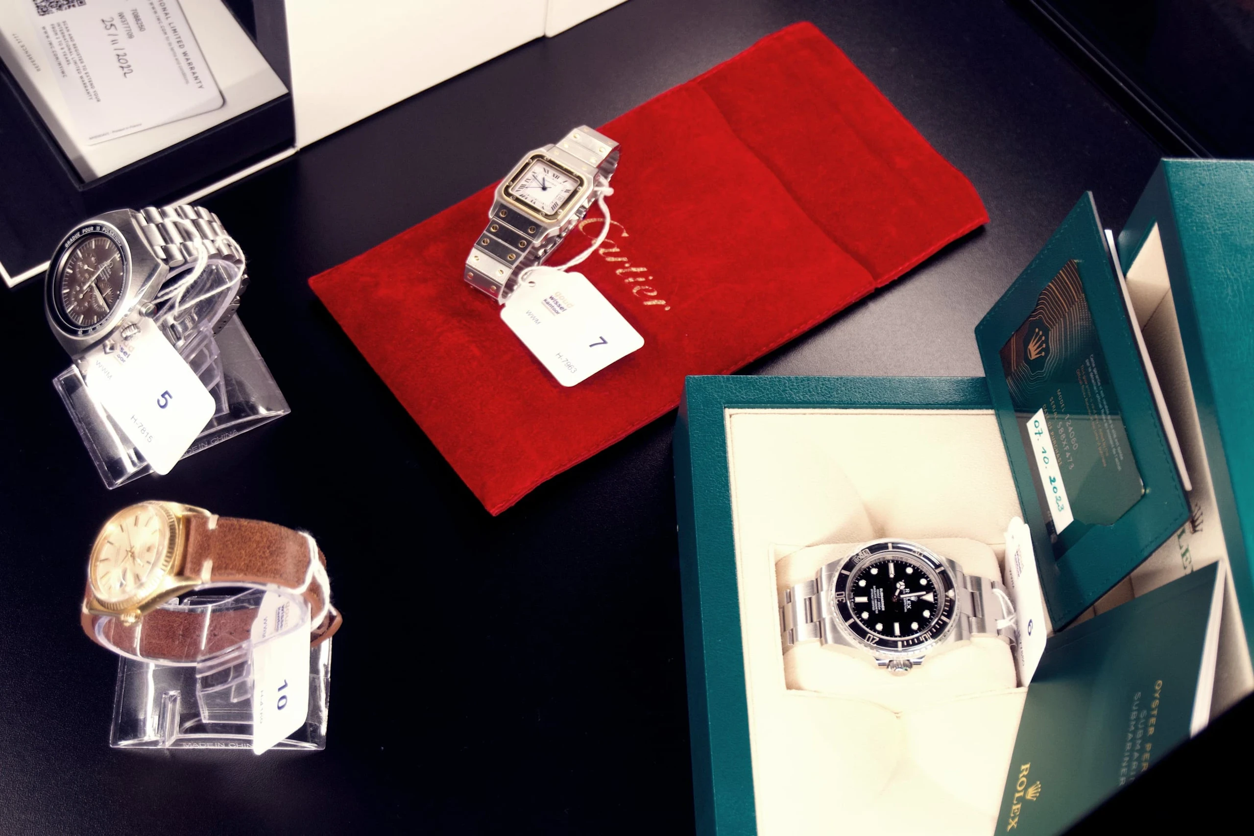 Watches presented on red and white stands at the Worldwatch launch
