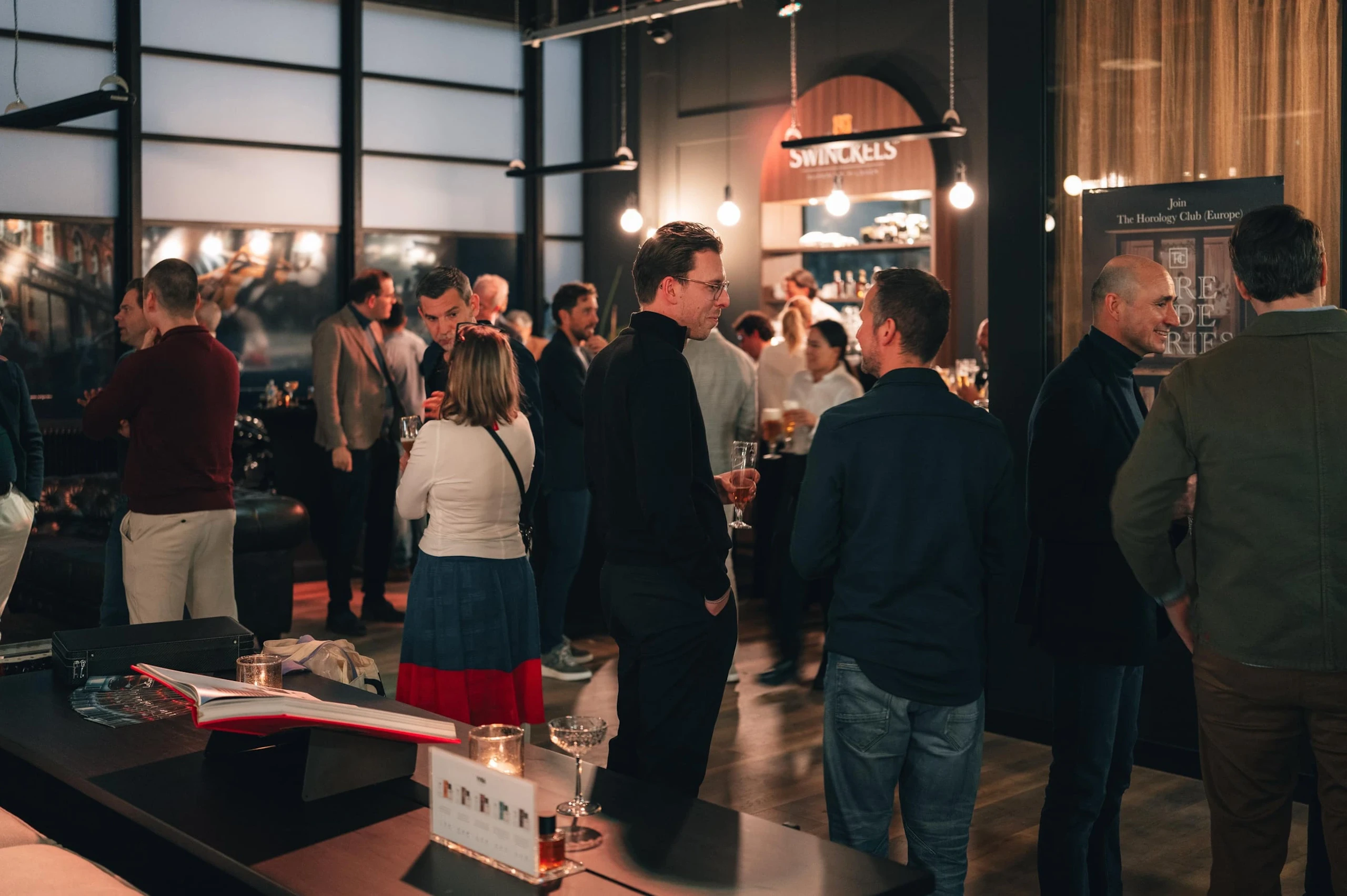 A crowded room of guests at the Lecarage evening